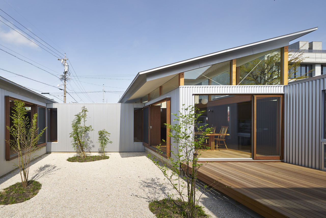 house with gardens and roofs arii irie architects